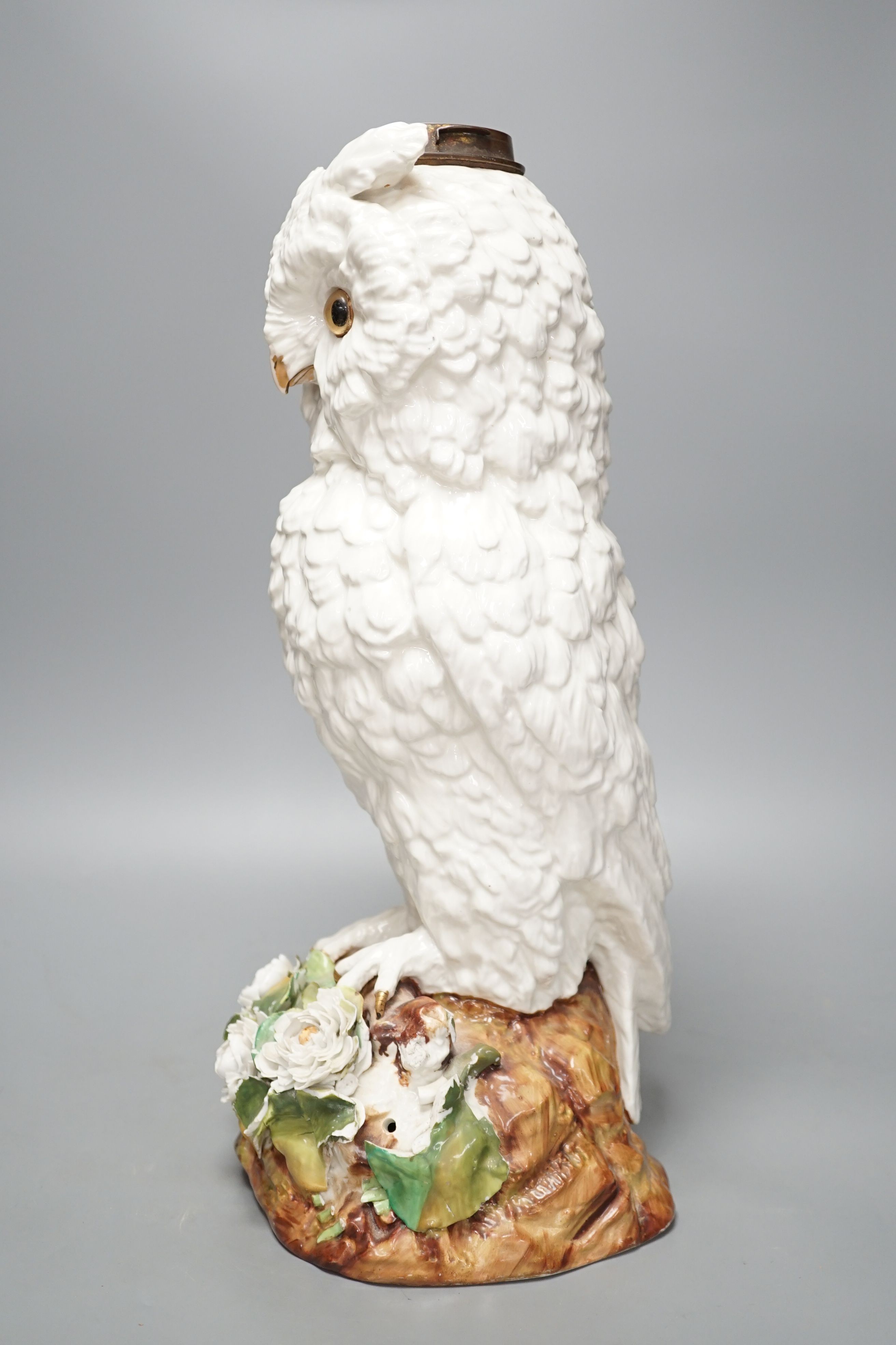 A large late 19th century ‘owl’ porcelain oil lamp base, with Victorian lozenge registration mark to base, probably Sitzendorf, 46 cms high.